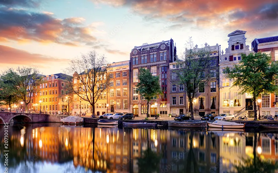 Amsterdam canal houses sunset